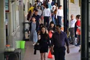 Office workers buying food to go at Amoy Street Food Centre on March 26, 2020.
