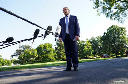 U.S. President Donald Trump talks to reporters as he departs for the Camp David, Maryland presidential retreat from the South…