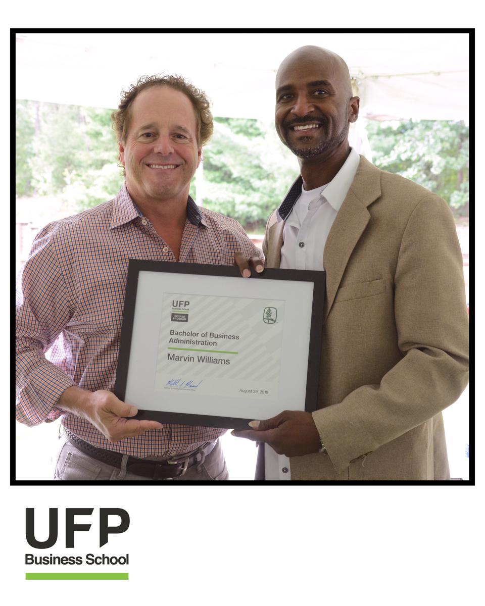 A graduate from UFP Business School received his certificate.