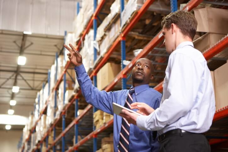 Supply chain managers in a warehouse