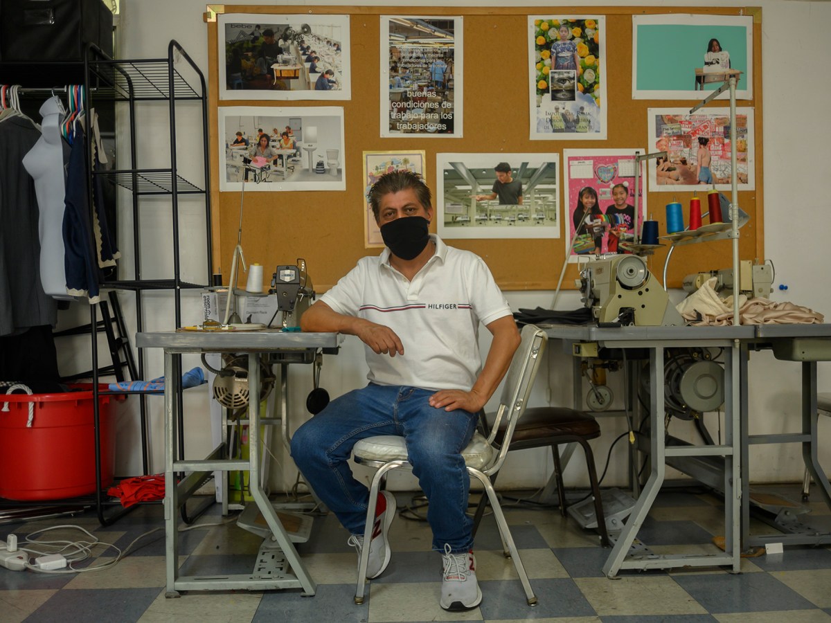Francisco Tzul, a garment worker in Los Angeles, CA sits in The Garment Worker Center during his lunch break on Sept. 11,2020. Photo by Tash Kimmell for CalMatters.