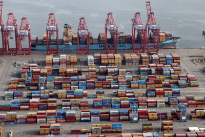 Shipping containers are unloaded from a ship at a container terminal at the Port of Long Beach-Port of Los Angeles complex, in Los Angeles, California, US, 7 April 2021 (Photo: Reuters/Lucy Nicholson).