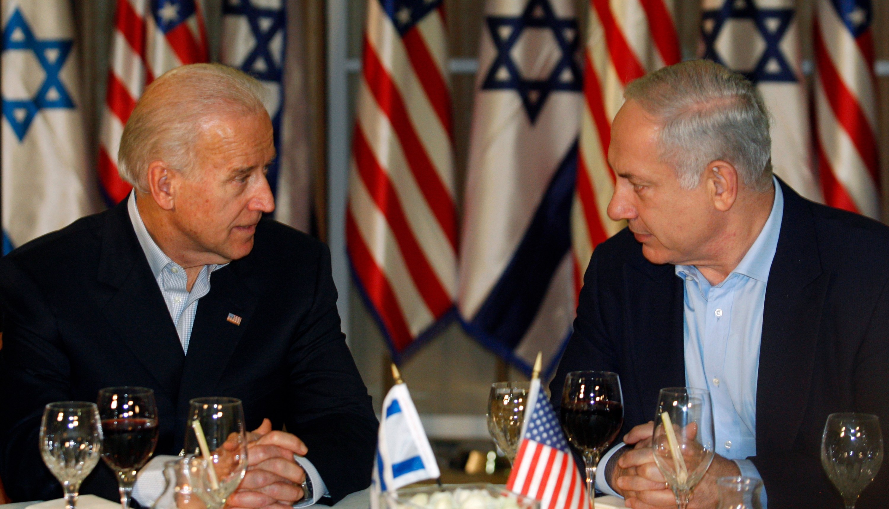 U.S. Vice President Joe Biden sits with Israel's Prime Minister Benjamin Netanyahu (R) before a dinner at the Prime Minister's residence in Jerusalem March 9, 2010. Biden assured Israel on Tuesday of Washington's commitment to its security and preventing Iran from producing nuclear weapons. REUTERS/Baz Ratner (JERUSALEM - Tags: POLITICS)