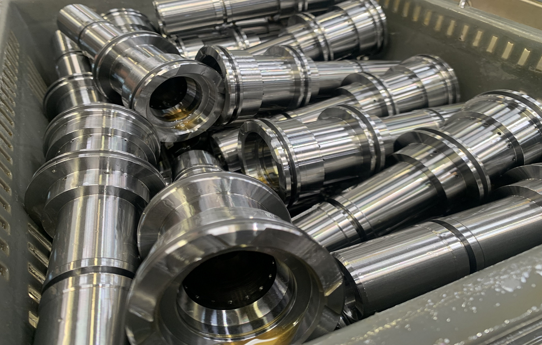 A collection of large components machined on a Nakamura-Tome machine