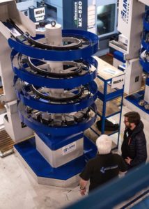 Factory shot with automated manufacturing machinery in view